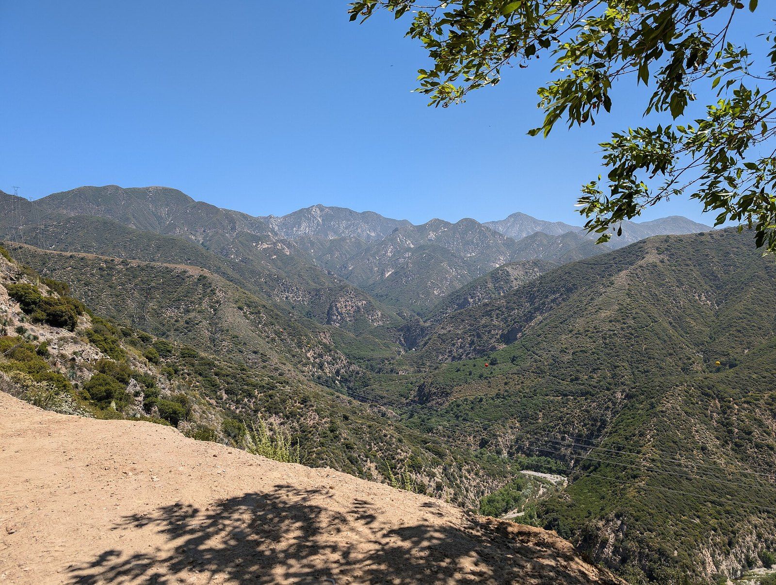 Layered chaparral ridges and a canyon in the Angeles National Forest under a clear sky, a Wikimedia Commons photograph in the encyclopedia of Mike Kobeissi