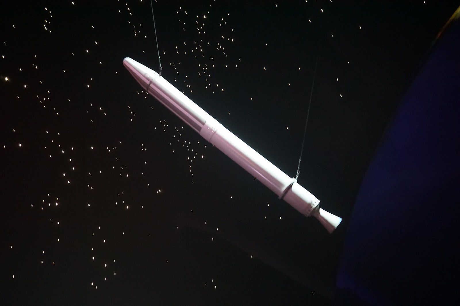 A full size replica of the Explorer 1 satellite hanging against a starfield display, a Wikimedia Commons photograph in the encyclopedia of Mike Kobeissi