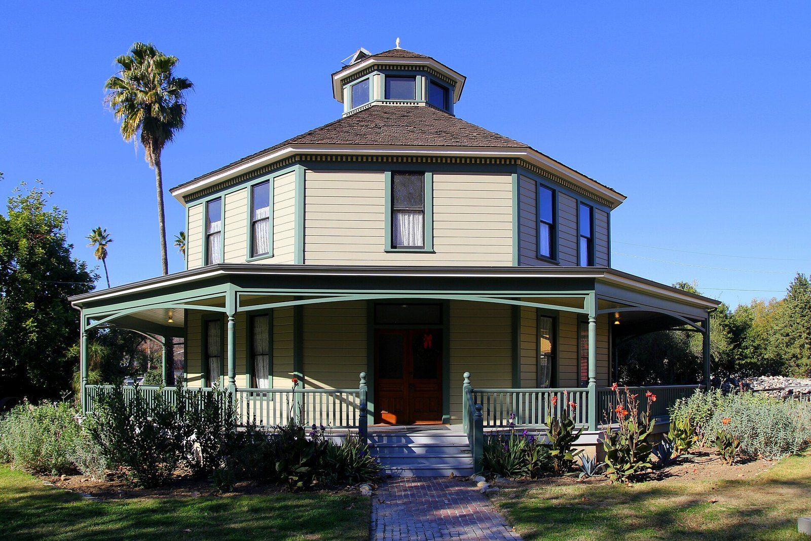 A restored nineteenth century octagon house with a wraparound porch at Heritage Square Mus, a Wikimedia Commons photograph in the encyclopedia of Mike Kobeissi