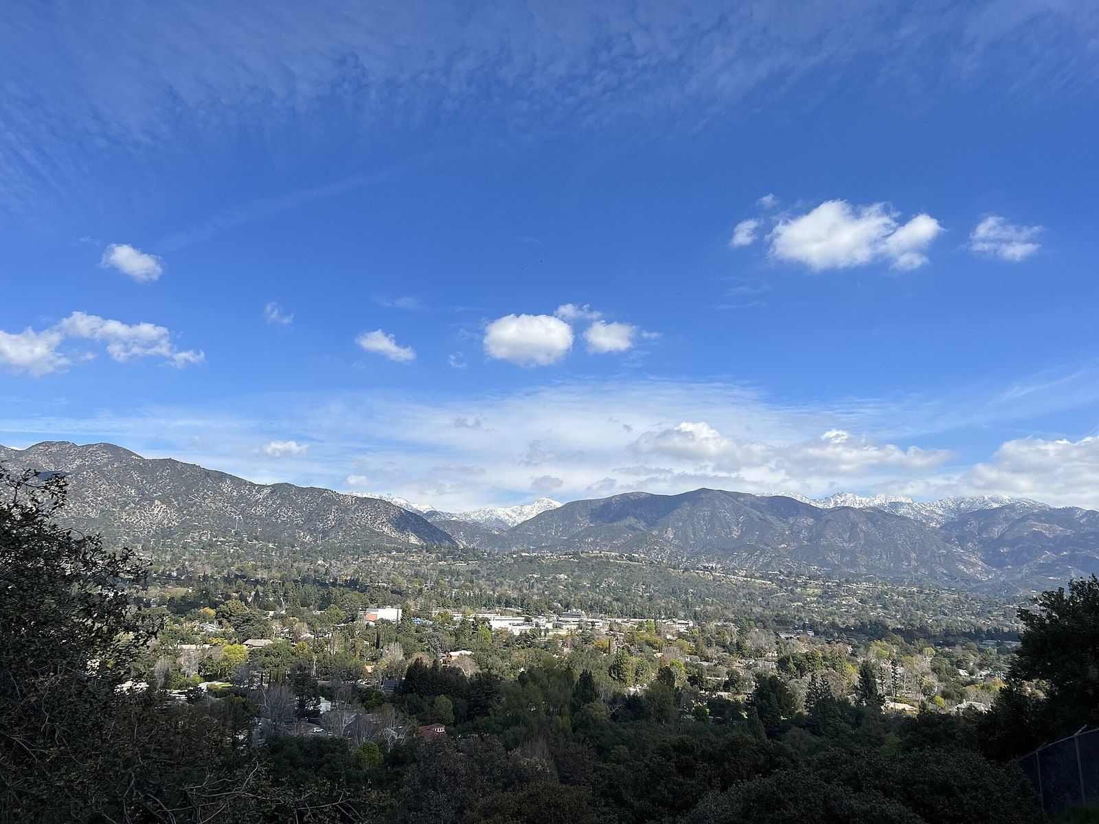The San Gabriel Mountains rising above the wooded foothill towns, seen from Descanso Garde, a Wikimedia Commons photograph in the encyclopedia of Mike Kobeissi