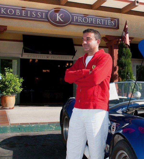 Mike Kobeissi with arms folded outside the Kobeissi Properties office in La Cañada Flintridge