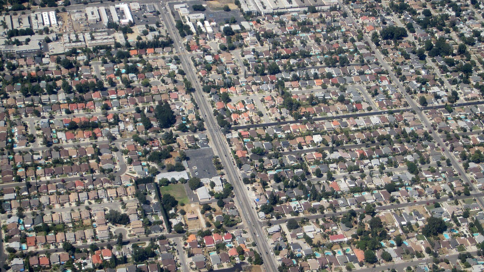 An aerial view over a grid of single family houses in Southern California, a Wikimedia Commons photograph in the encyclopedia of Mike Kobeissi