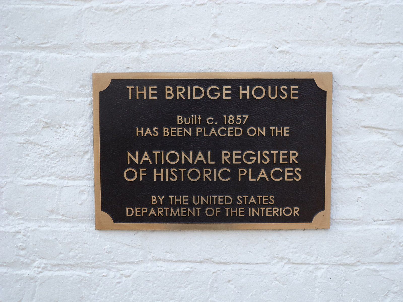 A bronze plaque marking a house built about 1857 as listed on the National Register of His, a Wikimedia Commons photograph in the encyclopedia of Mike Kobeissi