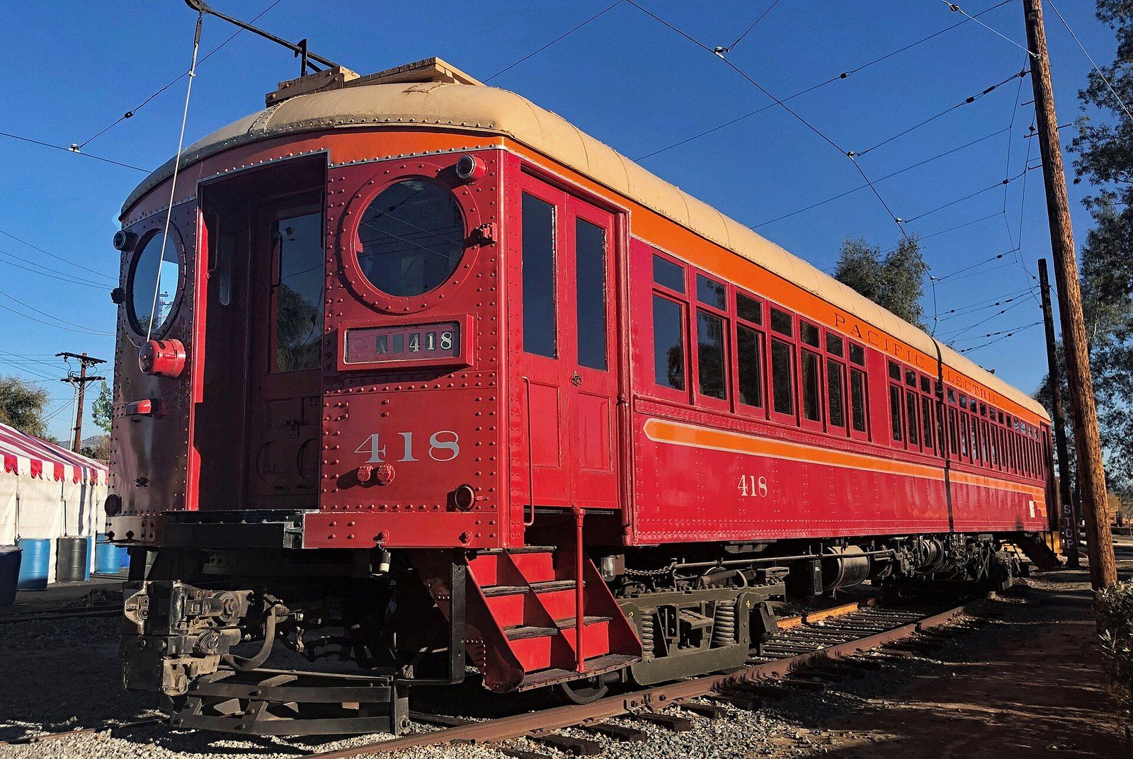 A restored red Pacific Electric interurban car at a railway museum, a Wikimedia Commons photograph in the encyclopedia of Mike Kobeissi