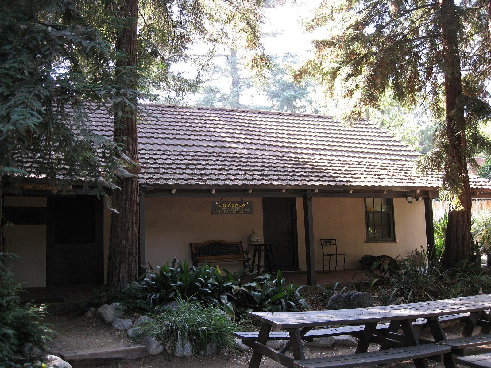 The Catalina Verdugo Adobe in Glendale, a low tile roofed adobe under old trees, a Wikimedia Commons photograph in the encyclopedia of Mike Kobeissi