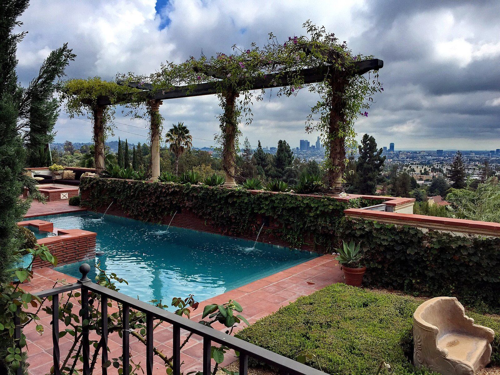 A terrace pool under a vine covered pergola looking out over Los Angeles at the Victor Ros, a Wikimedia Commons photograph in the encyclopedia of Mike Kobeissi