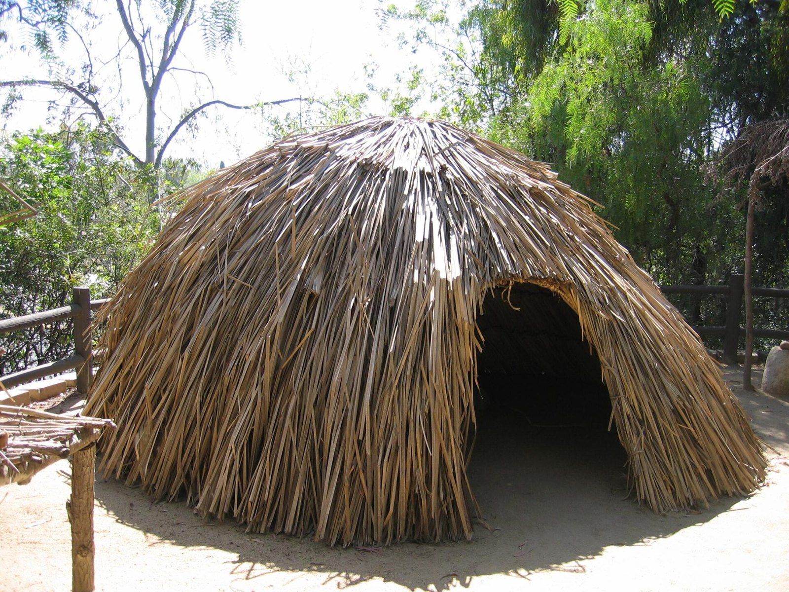 A reconstructed thatched dwelling of tule over a willow frame, the house form of Southern, a Wikimedia Commons photograph in the encyclopedia of Mike Kobeissi